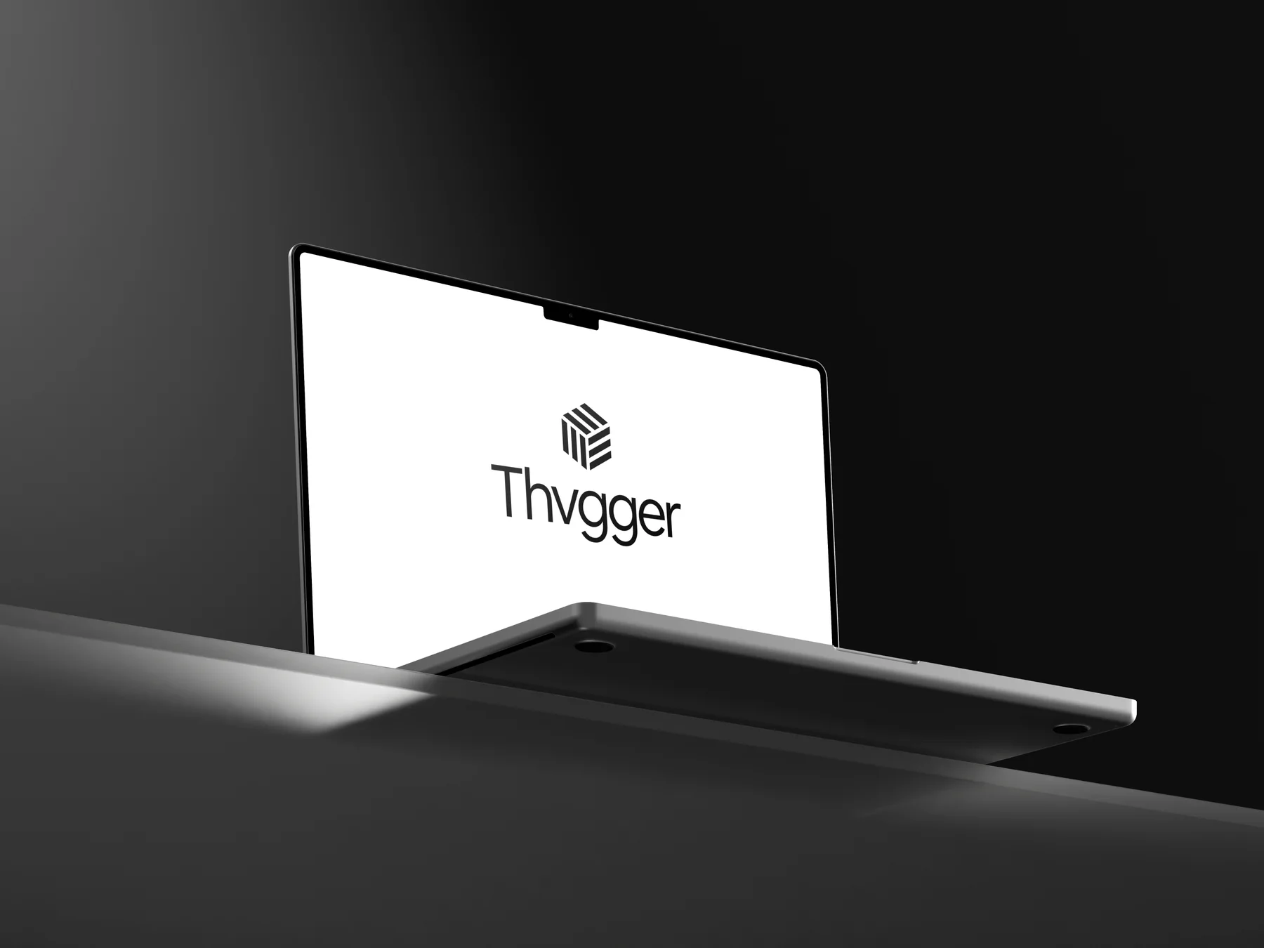 Thvgger identity on a laptop in a dark sculptural setting